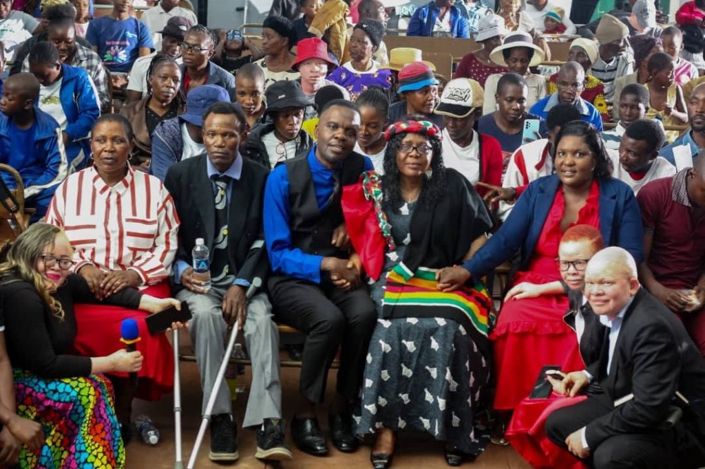 Community members gathered together, including people with disabilities